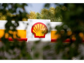 A scallop shaped Shell logo sits on display above a newly opened gas station, operated by Royal Dutch Shell Plc, in Kemerovo, Russia, on Friday, Sept. 14, 2018. Royal Dutch Shell plans to double the number of its petrol stations in Russia to 450, says Sergey Starodubtsev, the director-general of Shell Neft, the company's Russian subsidiary. Photographer: Andrey Rudakov/Bloomberg