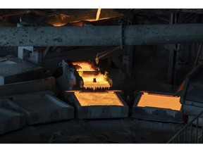 Molten copper flows into a casting vessel at the Jinguan Copper smelter, operated by Tongling Nonferrous Metals Group Co., in Tongling, Anhui province, China, on Thursday, Jan. 17, 2019. On the heels of record refined copper output last year, China's No. 2 producer, Tongling, says it'll defy economic gloom and strive to churn out even more of the metal in 2019. Photographer: Qilai Shen/Bloomberg