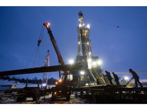 An oil drilling rig, operated by Tatneft PJSC, operates at night on an oilfield near Almetyevsk, Tatarstan, Russia, on Tuesday, March 6, 2019. Tatneft explores for, produces, refines, and markets crude oil.