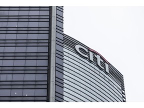 The Citigroup Inc. logo is displayed atop the Champion Tower, right, in Hong Kong, China, on Saturday, March 23, 2019. Citigroup, the global investment bank with a major presence in Asia, has ousted eight equities traders in Hong Kong and suspended three others after a sweeping internal investigation into its dealings with some clients, people familiar with the matter said. Photographer: Justin Chin/Bloomberg
