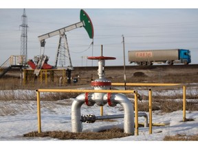 An oil pumping jack, also known as "nodding donkey", operated by Tatneft PJSC, stands in an oilfield near Almetyevsk, Tatarstan, Russia, on Wednesday, March 11, 2020. Saudi Aramco plans to boost its oil-output capacity for the first time in a decade as the world's biggest exporter raises the stakes in a price and supply war with Russia and U.S. shale producers. Photographer: Andrey Rudakov/Bloomberg
