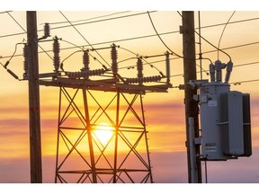 Power lines and transmission towers at sunrise in Crockett, California, US, on Wednesday, Aug. 19, 2020. On Tuesday -- just as California was preparing to plunge as many as 6 million people into darkness to save the power system from one of the worst heat waves in generations -- blazes torched tens of thousands of acres, forcing people to flee their homes and prompting California Governor Gavin Newsom to declare a state of emergency only days into the peak of the wildfire season.