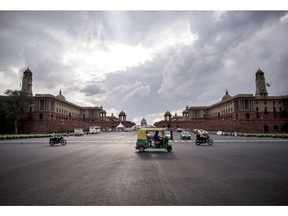 Traffic move along a street near the Central Secretariat buildings in New Delhi, India, on Monday, Aug. 31, 2020. Once the world's fastest-growing major economy, India is set to post the steepest quarterly decline in gross domestic product in Asia as it quickly becomes the global hotspot for coronavirus infections. Photographer: Anindito Mukherjee/Bloomberg