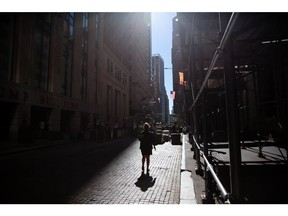 A pedestrian on Wall Street near the New York Stock Exchange (NYSE) in New York, U.S., on Tuesday, Sept. 7, 2021. Photographer: Michael Nagle/Bloomberg