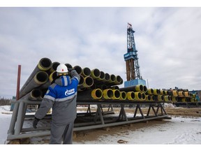 A worker inspects drilling pipes at a gas drilling rig on the Gazprom PJSC Chayandinskoye oil, gas and condensate field, a resource base for the Power of Siberia gas pipeline, in the Lensk district of the Sakha Republic, Russia, on Wednesday, Oct. 13, 2021. European natural gas futures declined after Russia signaled that it may offer additional volumes soon.