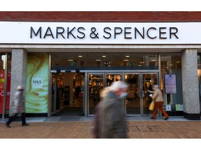 Pedestrians pass a Marks & Spencer Group Plc store in Chelmsford, U.K., on Wednesday, Jan. 12, 2022. U.K. retailers so far have largely been saying they fared well through the holiday season.