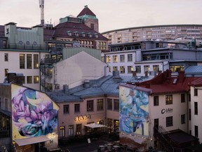 Electric lights on in homes and businesses at dusk in Gothenburg, Sweden, on Thursday, Jan. 13, 2022. The Swedish government set aside 6 billion kronor ($664 million) to lessen the impact of soaring power bills on households, saying Russia's approach to supplying gas to Europe this winter was a major factor in stoking costs last month.