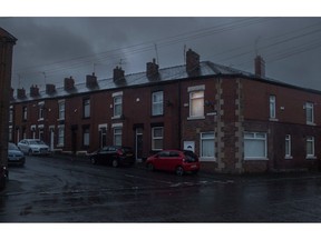A light on in a residential house at dawn in the Stalybridge district of Greater Manchester, U.K., on Monday, Feb. 21, 2022. About 6 million families in the U.K. will pay a combined 3.9 billion-pound ($5.2 billion) surcharge on their energy bills when the price cap rises in April, according to think tank the Resolution Foundation. Photographer: Anthony Devlin/Bloomberg