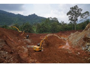 Excavators in a pit at a nickel mine operated by PT Teknik Alum Service in Morowali Regency, Central Sulawesi, Indonesia, on Thursday, March 17, 2022. Indonesia, the world's top nickel producer, will raise production capacity of the metal after prices soared past $100,000 a ton, while the coal market is unlikely to get similar relief.