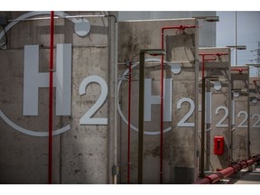 The chemical symbol for hydrogen on tank separation walls during the final stages of construction at Iberdola SA's Puertollano green hydrogen plant in Puertollano, Spain, on Thursday, May 19, 2022. The new plant will be Europe's largest production site for green hydrogen for industrial use. Photographer: Angel Garcia/Bloomberg