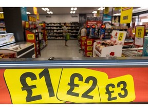 An advertisement above a freezer at an Iceland Foods Ltd. supermarket in Christchurch, UK, on Wednesday, June 15, 2022. "Britain's cost-of-living crisis -- on track to big the biggest squeeze since the mid-70s -- will continue to worsen before it starts to ease at some point next year," said Jack Leslie, senior economist at the Resolution Foundation, a research group campaigning against poverty. Photographer: Chris Ratcliffe/Bloomberg