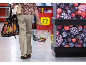 A customer carries a basket of food items at an Iceland Foods Ltd. supermarket in Christchurch, UK, on Wednesday, June 15, 2022. "Britain's cost-of-living crisis -- on track to big the biggest squeeze since the mid-70s -- will continue to worsen before it starts to ease at some point next year," said Jack Leslie, senior economist at the Resolution Foundation, a research group campaigning against poverty.