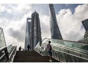 Pedestrians in Pudong's Lujiazui Financial District in Shanghai, China, on Monday, June 20, 2022. Shanghai's weekend Covid-testing blitz found the virus seemingly contained, after a spike in cases last week had fanned concern the city would be plunged back into lockdown. Photographer: Qilai Shen/Bloomberg