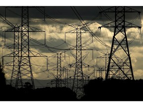 Transmission towers in Sydney, Australia, on Monday, June 20, 2022. Australia's electricity system manager is so stretched by a squeeze on the nation's energy supply that it's being forced to delay connecting some new projects to the grid. Photographer: Brendon Thorne/Bloomberg