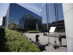 A member of the media outside the Bank of Canada in Ottawa, Ontario, Canada, on Wednesday, July 13, 2022. The Bank of Canada hiked interest rates by a full percentage point, a surprise move that supercharges efforts to withdraw stimulus before four-decade-high inflation becomes entrenched.