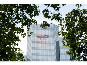 Signage for TotalEnergies SE at the company's headquarters in the La Defense business district in Paris, France, on Thursday, July 28, 2021. TotalEnergies will extend its $2 billion buyback program into the third quarter after profit surged to a record, propelled by surging gasoline prices and soaring demand for natural gas in Europe.
