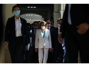 US House Speaker Nancy Pelosi, center, arrives at the Legislative Yuan in Taipei, Taiwan, on Wednesday, Aug. 3, 2022. Pelosi became the highest-ranking American politician to visit Taiwan in 25 years, prompting China to announce missile tests and military drills encircling the island that set the stage for some of its most provocative actions in decades.