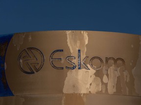 A dilapidated sign outside the Eskom Holdings SOC Ltd. Acacia electrical substation in the Monte Vista district of Cape Town, South Africa, on Tuesday, Aug. 2, 2022. South Africa's state-owned power utility Eskom warned it may have to implement rolling blackouts for the first time in more than a week due to a shortage of generation capacity. Photographer: Dwayne Senior/Bloomberg