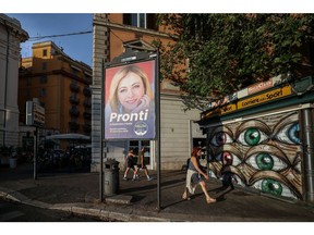 An election poster featuring an image of Giorgia Meloni, leader of the Brothers of Italy party, reading 
