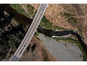 Traffic on Highway 20 over the East Fork Russian River at Lake Mendocino during a drought in Mendocino County, California, US, on Wednesday, Aug. 10, 2022. California water prices are at all-time high as a severe drought chokes off supplies to cities and farms across the Golden State.