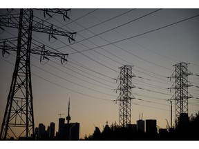 Hydro towers at dusk in Toronto, Ontario, Canada, on Thursday, Aug. 11, 2022. A power failure in downtown Toronto has knocked out electricity in parts of the citys financial district, affecting about 10,000 customers.