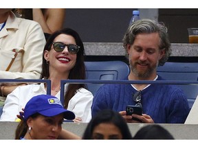 Actors Anne Hathaway and Adam Shulman watch the Men's Singles Final match during the 2022 US Open at USTA Billie Jean King National Tennis Center on Sept. 11, 2022.