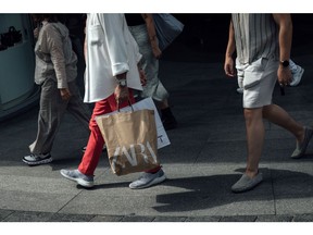 A shopper carries a Zara-branded bag in the old town area of Brussels, Belgium, on Monday, Aug. 29, 2022. Belgian inflation hit a 46-Year high of 9.94% as the cost of natural gas more than doubled.