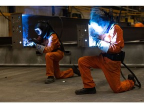 Employees weld sections of fabricated steel beams at Severfield Plc steel fabricators in Dalton, near Thirsk, UK, on Sunday, Aug. 22, 2022. The UK is considering measures to alleviate soaring electricity bills for energy-intensive industries such as steel, ceramics and cement in a bid to protect jobs and boost competitiveness.