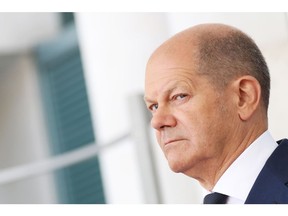 Olaf Scholz, Germany's chancellor, during a review of an honor guard at the Chancellery in Berlin, Germany, on Sunday, Sept. 2, 2022. Scholz's coalition agreed on a relief plan worth about 65 billion euros ($65 billion) to help millions of households struggling with soaring prices amid Europe's harshest energy crunch in decades..