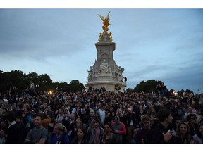 Well-wishers gather outside Buckingham Palace following the announcement of the death of Queen Elizabeth II, in London, on Sept. 8.