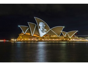 SYDNEY, AUSTRALIA - SEPTEMBER 10: An image of the late Queen Elizabeth II is projected onto the sails of the Sydney Opera House on September 10, 2022 in Sydney, Australia. Queen Elizabeth II died at Balmoral Castle in Scotland aged 96 on September 8, 2022, and is survived by her four children, Charles, Prince of Wales, Anne, Princess Royal, Andrew, Duke Of York and Edward, Duke of Wessex. Elizabeth Alexandra Mary Windsor was born in Bruton Street, Mayfair, London on 21 April 1926. She married Prince Philip in 1947 and acceded the throne of the United Kingdom and Commonwealth on 6 February 1952 after the death of her Father, King George VI. Queen Elizabeth II was the United Kingdom's longest-serving monarch.