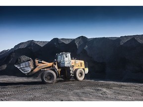 A wheel loader transports coal from a pile at the Mafube open-cast coal mine, operated by Exxaro Resources Ltd. and Thungela Resources Ltd., in Mpumalanga, South Africa on Friday, Sept. 9, 2022. South Africa relies on coal to generate more than 80% of its electricity, and has been subjected to intermittent outages since 2008 because state utility Eskom Holdings SOC Ltd. can't meet demand from its old and poorly maintained plants.