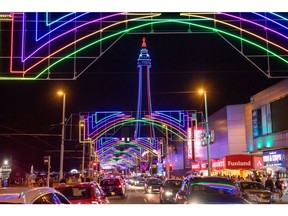 The Blackpool Tower, lit red, white and blue during the official period of mourning following the death of Queen Elizabeth II, at the Blackpool Illuminations annual lights festival along the Promenade in Blackpool, UK, on Saturday, Sept. 10, 2022. UK Prime Minister Liz Truss unveiled plans to freeze electricity bills for two years from October and introduce a cap to protect businesses for at least six months. Photographer: Anthony Devlin/Bloomberg