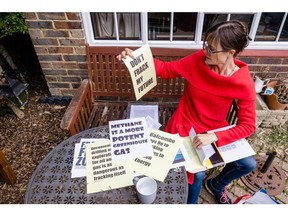 Activist Helen Savage, shows anti-fracking protest placards during an interview with Bloomberg at her house near the Cuadrilla shale gas drill site in Balcombe, West Sussex, UK, on Wednesday Sept. 21,  2022.