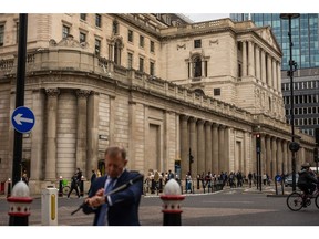 Commuters outside the Bank of England in London.