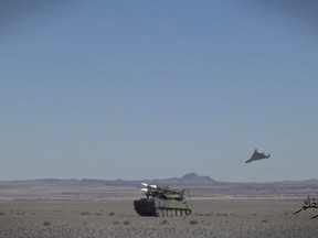 FILE - In this file photo released Friday, Jan. 15, 2021, by Imamedia, a triangle-shaped suicide drone approaches the target during a drill in Iran. Ukraine's military claimed Tuesday for the first time that it encountered a similar Iranian-supplied suicide drone used by Russia on the battlefield, showing the deepening ties between Moscow and Tehran as the Islamic Republic's tattered nuclear deal with world powers hangs in the balance. (Imamedia via AP, File)