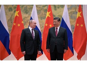 Russian President Vladimir Putin (L) and Chinese President Xi Jinping pose during their meeting in Beijing, on February 4, 2022. Photographer: Alexei Druzhinin/Sputnik/AFP/Getty Images
