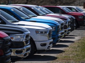 New Dodge Ram pickup trucks for sale are seen at an auto mall in Ottawa, on Monday, April 26, 2021. Car buyers during the pandemic have had to contend with empty dealership lots and soaring prices for used cars.