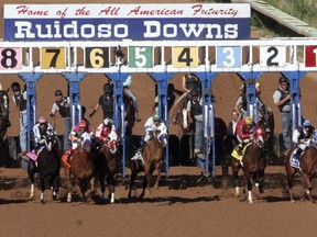 FILE - Horses leave the starting gate at Ruidoso Downs Racetrack and Casino in Ruidoso, N.M., Sept. 6, 2010. A top horse racing official in New Mexico says easing rules around online betting would help to ensure the industry's survival amid intense competition for gambling dollars.