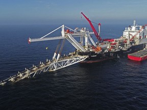 FILE - A ship works offshore in the Baltic Sea on the natural gas pipeline Nord Stream 2 from Russia to Germany, on Nov. 11, 2018. Denmark's maritime authority said Monday Sept. 26, 2022 that a gas leak had been observed in a pipeline leading from Russia to Europe underneath the Baltic Sea that is dangerous to shipping traffic.