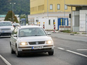 Cars make their way to the Austrian and Slovak border in Bratislava, Slovakia, Wednesday, Sept. 28, 2022.