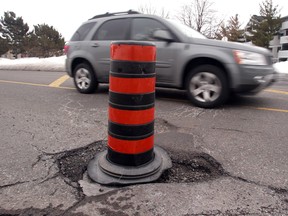 The country’s shoddy roads cost Canadian drivers $3 billion annually, study says. PHOTO BY BRUNO SCHLUMBERGER/THE OTTAWA CITIZEN FILES