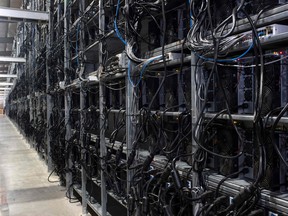 Bitcoin mining machines in a warehouse at the Whinstone U.S. Bitcoin mining facility in Rockdale, Texas.