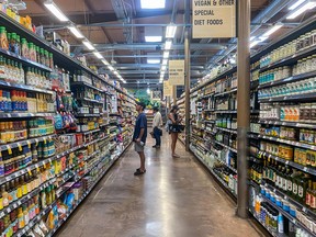 People shop at a supermarket in Santa Monica, California.