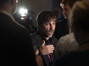 Minister of Environment and Climate Change Steven Guilbeault speaks to reporters at the Liberal summer caucus retreat in St. Andrews, N.B.
