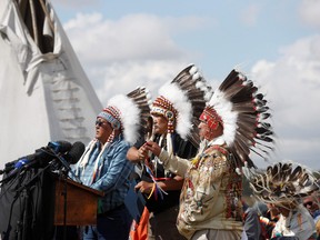 Chief Bart Tsannie, Grand Chief Brian Hardlotte and Vice Chief Christopher Jobb at a press conference at the James Smith Cree Nation on Sep. 8, 2022.