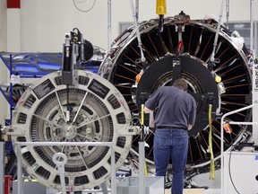 An employee assembles a LEAP jet engine at the General Electric Co. Aviation assembly plant in Lafayette, Indiana.