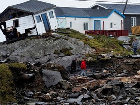 People head to their homes in the aftermath of Hurricane Fiona in Burnt Islands, Newfoundland.