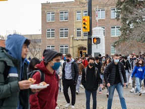 Students at Western Canada High School exit the school for their lunch break.