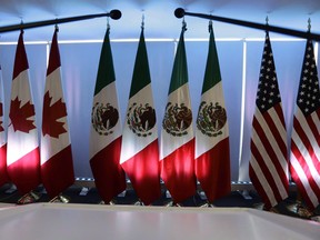 National flags representing Canada, Mexico and the United States at the North American Free Trade Agreement renegotiations in Mexico City, 2017.